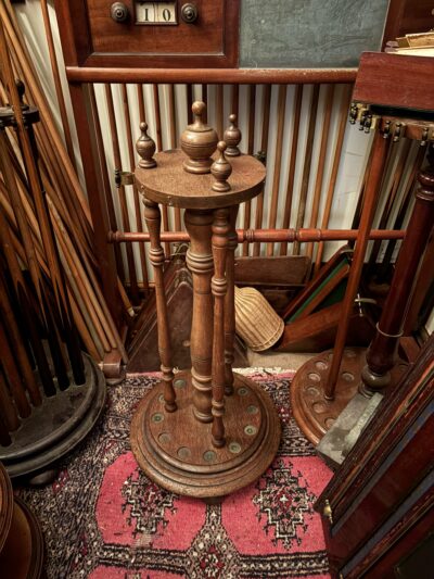 Antique Victorian Thurston oak revolving cue stand